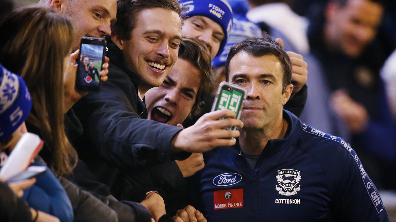 Chris Scott poses with fans for a selfie after the win. Pic: Michael Klein