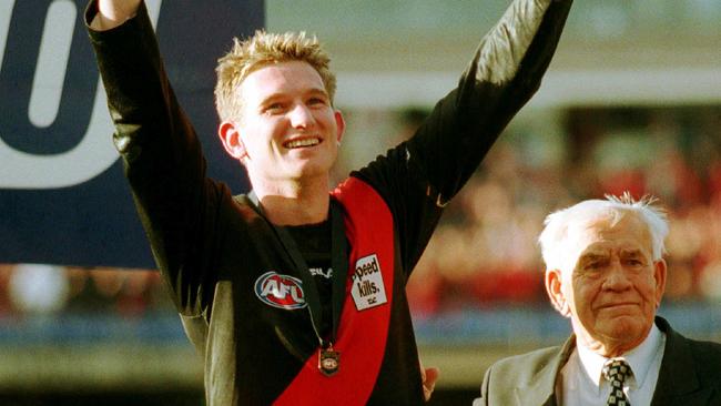 James Hird is presented with his Norm Smith Medal in 2000.