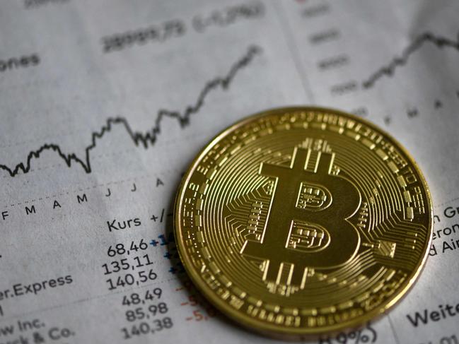 (FILES) In this file photo taken on January 27, 2020 a physical imitation of a Bitcoin is seen in Dortmund, western Germany, on January 27, 2020. - German authorities said on March 15, 2023 they had taken down the "world's largest" money laundering site for cryptocurrency, seizing millions of euros' worth of bitcoin in the process. (Photo by INA FASSBENDER / AFP)