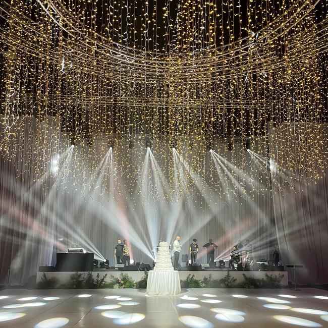 The 2m high wedding cake under the massive chandelier. Picture: Supplied