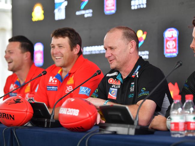 (L-R) Gold Coast Suns player Steven May, Gold Coast Suns coach Stuart Dew, Port Adelaide Power coach Ken Hinkley and Port Adelaide Power player Travis Boak speak to the media during a press conference at the Australia Hub, in Shanghai, China, Thursday, May 17, 2018. The Suns and the Power play on Saturday at Jiangwan Stadium in a rematch of last year's inaugural fixture. (AAP Image/David Mariuz) NO ARCHIVING