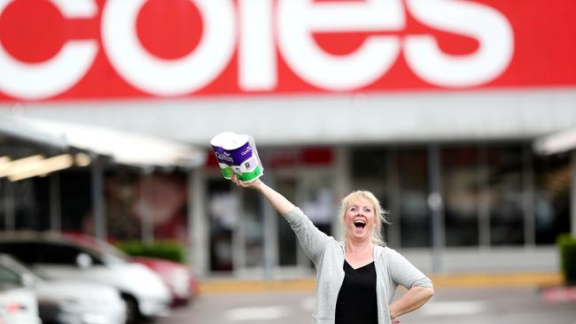 Sally Loughnan with a prized packet of toilet paper at Coles Lisarow on the NSW Central Coast during shortages in March. Picture: AAP