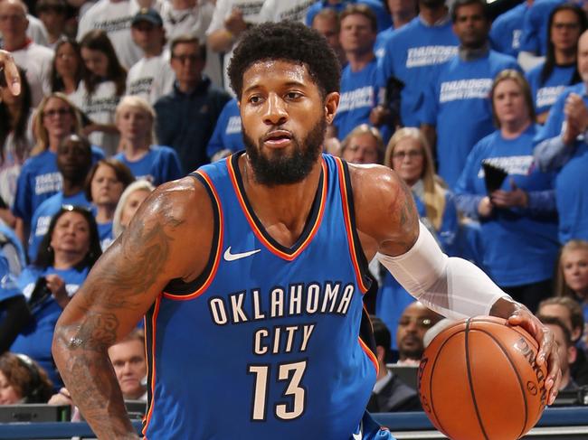 OKLAHOMA CITY, OK - APRIL 25: Paul George #13 of the Oklahoma City Thunder handles the ball against the Utah Jazz in Game Five of Round One of the 2018 NBA Playoffs on April 25, 2018 at Chesapeake Energy Arena in Oklahoma City, Oklahoma. NOTE TO USER: User expressly acknowledges and agrees that, by downloading and or using this photograph, User is consenting to the terms and conditions of the Getty Images License Agreement. Mandatory Copyright Notice: Copyright 2018 NBAE (Photo by Layne Murdoch/NBAE via Getty Images)