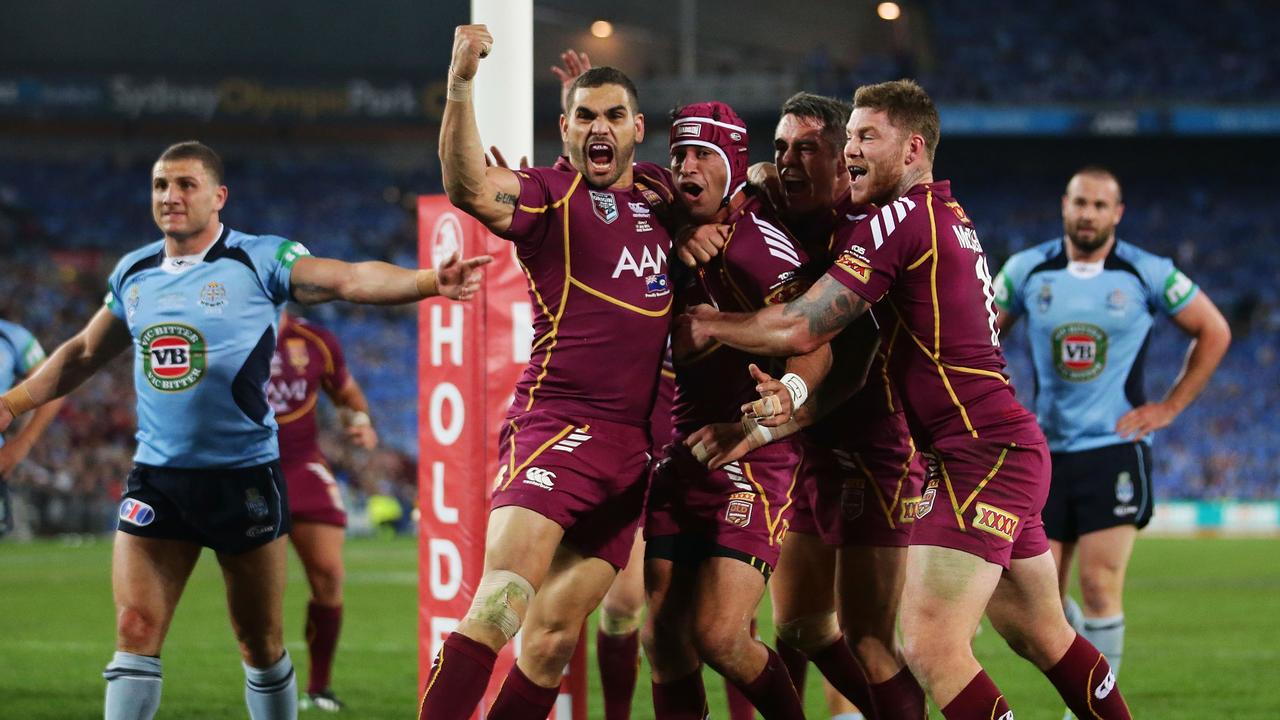 Johnathan Thurston of the Maroons celebrates with Greg Inglis.