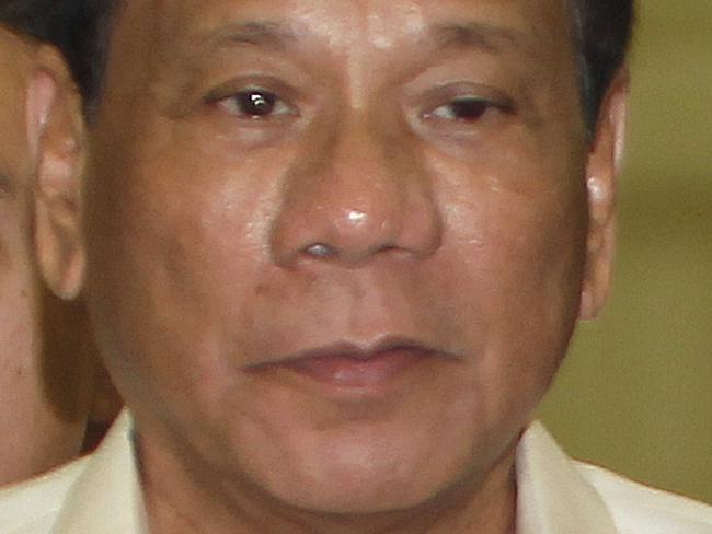 FILE - In this Dec. 14, 2016 file photo, Philippine President Rodrigo Duterte arrives for a meeting in Phnom Penh, Cambodia. The U.S. said Thursday, Dec. 15, 2016, it is withholding a major aid package to the Philippines and is deeply troubled by a boast from the nation's leader that he used to drive around looking for criminals to kill. (AP Photo/Heng Sinith, File)