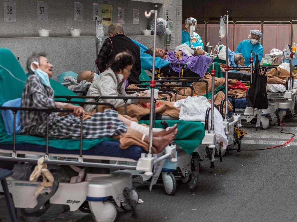 Health workers treat patients in a holding area next to the accident and emergency department of Princess Margaret hospital in Hong Kong in March 2022. Picture: AFP