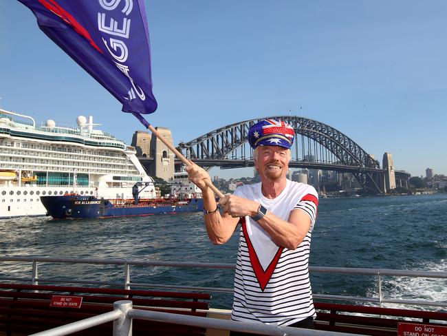 Sir Richard Branson greets commuters on a Sydney Ferry to announce Virgin Voyages and Virgin Australia will offer flight and cruise packages for Aussies wanting to cruise the Caribbean. Picture: Toby Zerna