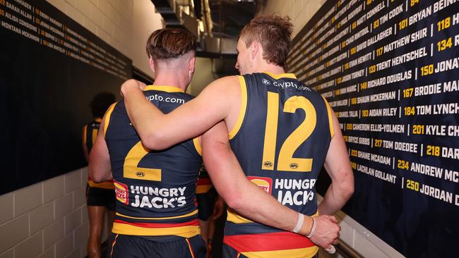 Ben Keays and Jordan Dawson savour the win against Carlton. Picture: Sarah Reed/AFL Photos via Getty Images