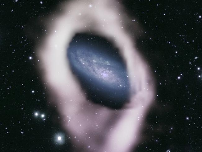 International astronomers using a telescope owned and operated by CSIRO, Australia’s national science agency, have revealed a galaxy wrapped in a cosmic ‘ribbon’. Photo: Supplied