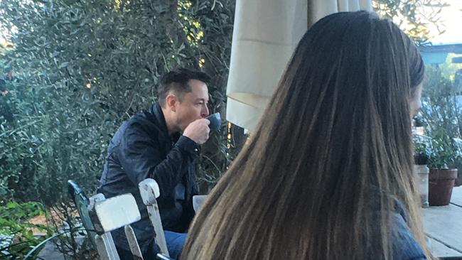 Elon Musk sipping his coffee while enjoying breakfast with Amber Heard. Photo: Sally Coates