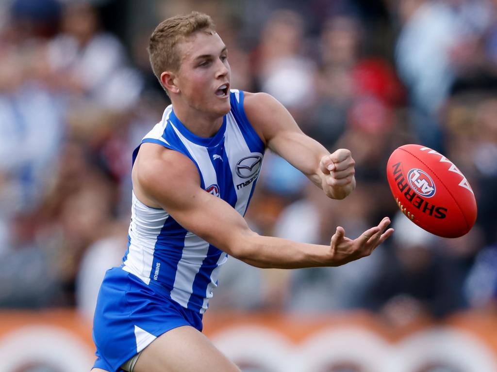 Tom Powell fires a handball. Picture: Dylan Burns/AFL Photos