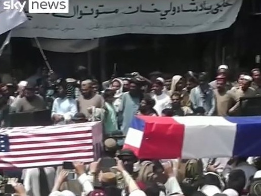 Taliban supporters hold mock funeral with coffins draped in UK and US flags. Picture: Sky News