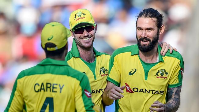 Kane Richardson (right) has chosen to stay with his family in Adelaide and will miss the limited overs series against India. Picture: Punit Paranjpe / AFP