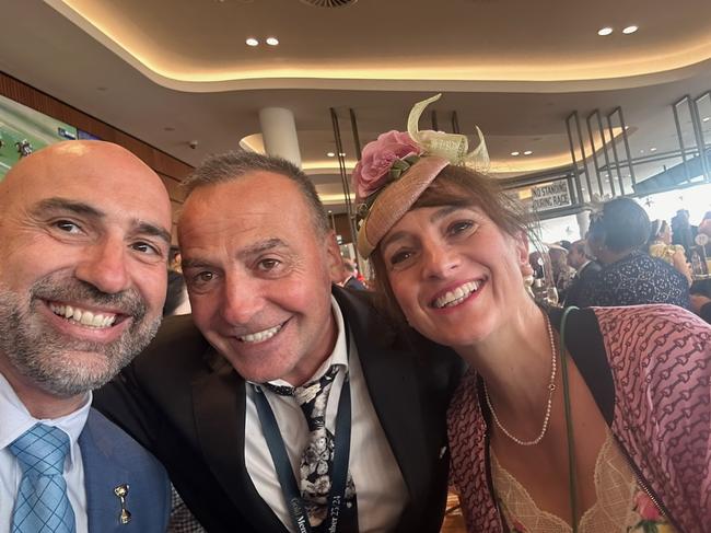 Nick Raptopoulos, Vlad Bogoevski and Vivian Bogoevski inside the members at Flemington on Stakes Day.