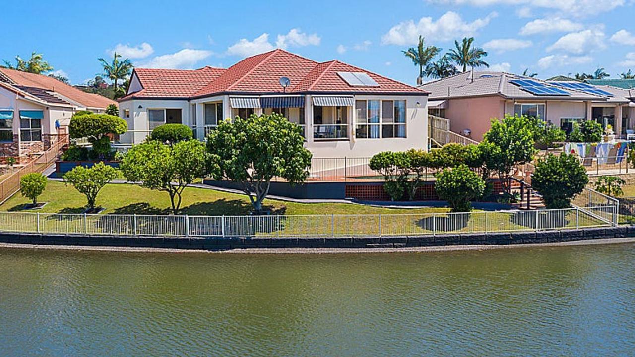 This four-bedroom house at 9 Seychelles Court, Burleigh Waters, is scheduled for auction.