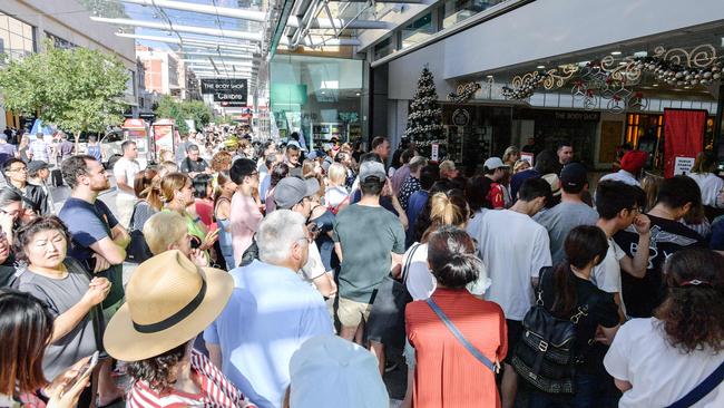 Boxing Day shoppers wait outside David Jones in Rundle Mall for the start of the sales. Picture: AAP / Morgan Sette