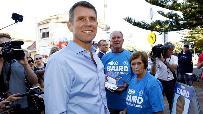 Former NSW Premier Mike Baird with his father Bruce Baird and mother Judy outside Queenscliff Surf Life Saving Club to cast his vote at the 2015 state election. (AAP Image/Nikki Short)