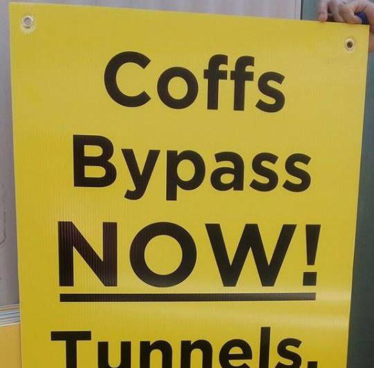 One of the signs placed along the highway by the Coffs Harbour councillors bypass working group.