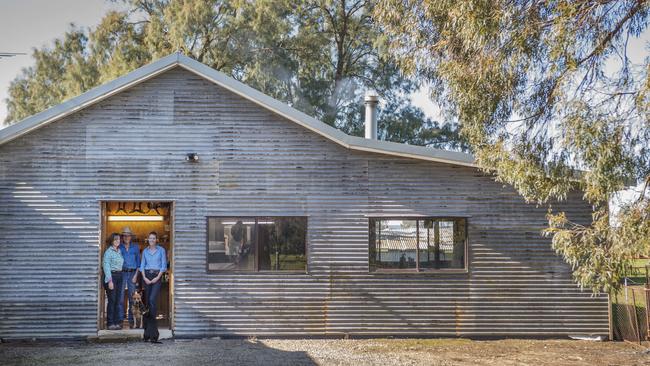 Business hub: Sharron and George Taylor and their daughter Sarah at their workshop with their dogs Lucy and Maggie. Picture: Zoe Phillips