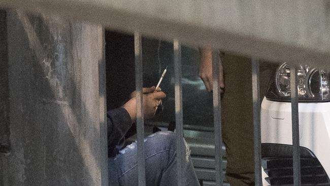 A heroin drug user injects in a carpark in Richmond. Picture: Jason Edwards