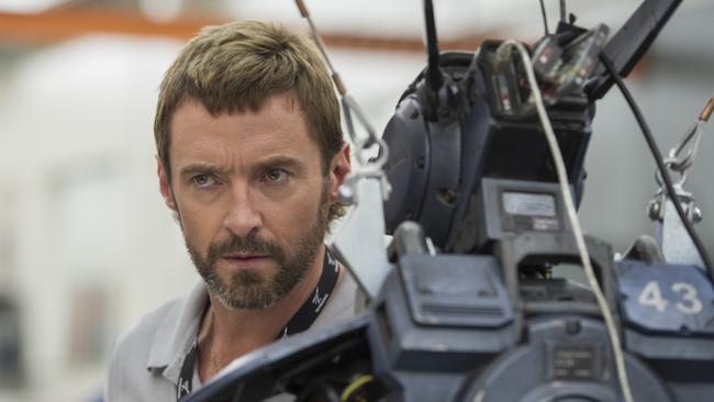 <b>(L-R)— Hugh Jackman, Hugh Jackman’s semi-mullet, Chappie the cop-bot in <i>Chappie.</i></b>