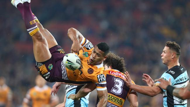 BRISBANE, AUSTRALIA — JULY 26: Jamayne Isaako of the Broncos is tackled in the air during the round 20 NRL match between the Brisbane Broncos and the Cronulla Sharks at Suncorp Stadium on July 26, 2018 in Brisbane, Australia. (Photo by Chris Hyde/Getty Images)