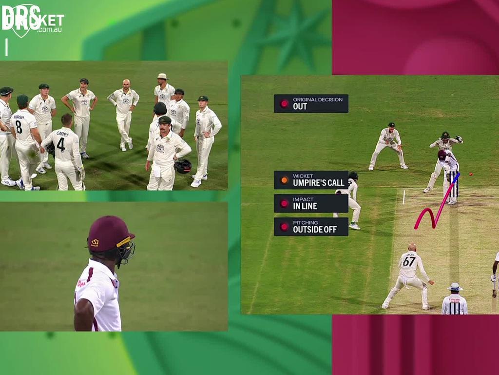 Nathan Lyon gets Kemar Roach lbw on review.