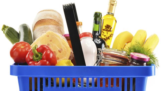 Shopping basket with variety of grocery products isolated on white. Generic from Thinkstock