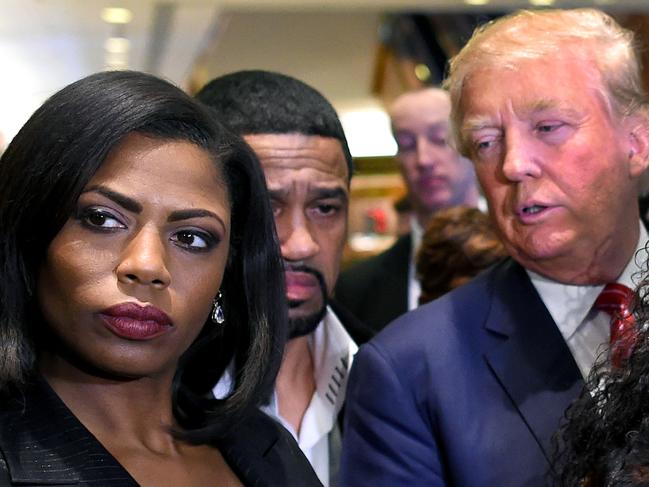 (FILES) In this file photo taken on December 01, 2015, Omarosa Manigault Newman (L) appears alongside Republican presidential hopeful Donald Trump (R) during a press conference that followed Trump's meeting with African-American religious leaders in New York. - US resident Donald Trump on August 14, 2018, lashed out at his former White House aide Omarosa Manigault Newman in especially angry terms, slamming her as a "dog" and "crazed" as their mud-slinging match escalated. (Photo by Timothy A. CLARY / AFP)