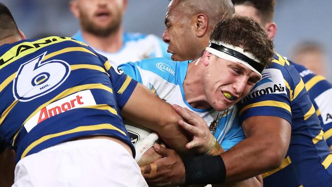 SYDNEY, AUSTRALIA — AUGUST 04: Jarrod Wallace of the Titans is tackled by the Eels defence during the round 21 NRL match between the Parramatta Eels and the Gold Coast Titans at ANZ Stadium on August 4, 2018 in Sydney, Australia. (Photo by Brendon Thorne/Getty Images)