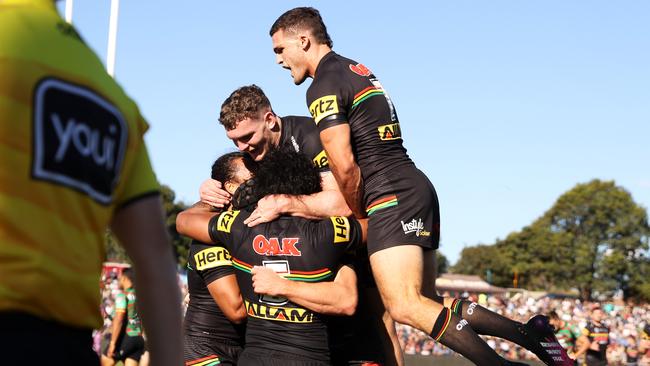 Matt Burton (unseen) celebrates one of three tries (Photo by Mark Kolbe/Getty Images)