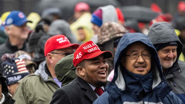 Supporters of US President-elect Donald Trump line up on the National Mall for a MAGA victory rally at Capital One Arena in Washington, DC. Picture: AFP