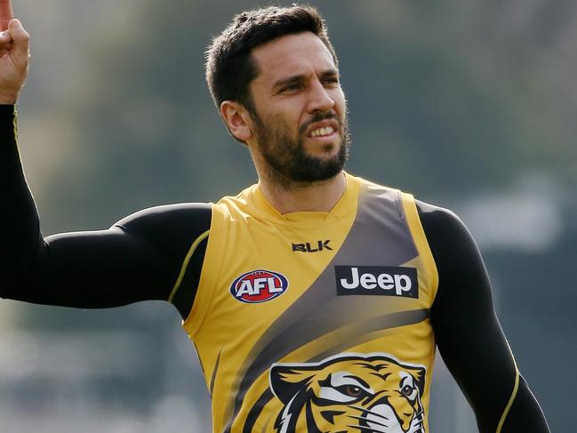 Richmond training at ME Bank centre, Melbourne. Troy Chaplin gives the finger to teammates after they heckled him. 21st August 2014. Picture: Colleen Petch.