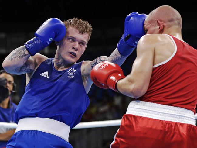 Australia's Daniel Jason Lewis, right, fights Poland's Tomasz Jablonski during a men's middleweight 75-kg boxing match at the 2016 Summer Olympics in Rio de Janeiro, Brazil, Tuesday, Aug. 9, 2016. (AP Photo/Frank Franklin II)