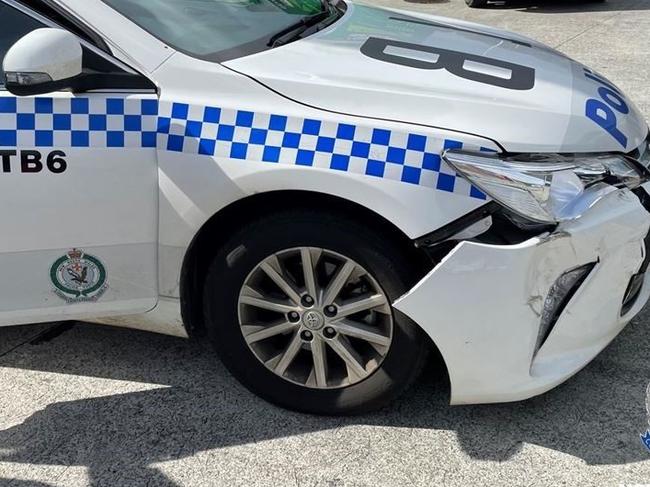 A police car was seriously damaged after it was rammed on the Pacific Highway on April 29, 2021.