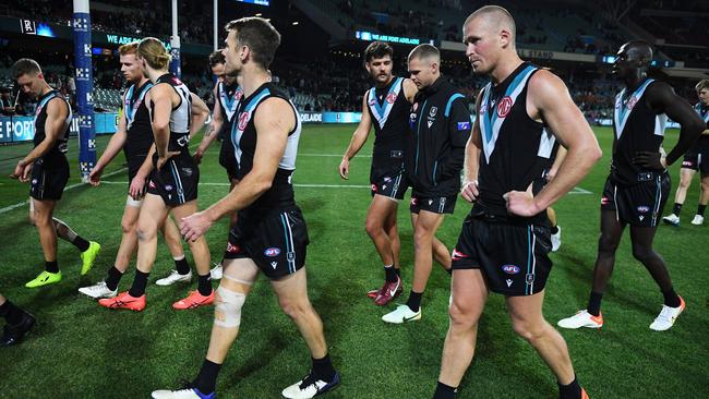 Port players leave the ground after losing to the Cats at Adelaide Oval. Picture: Mark Brake/Getty Images