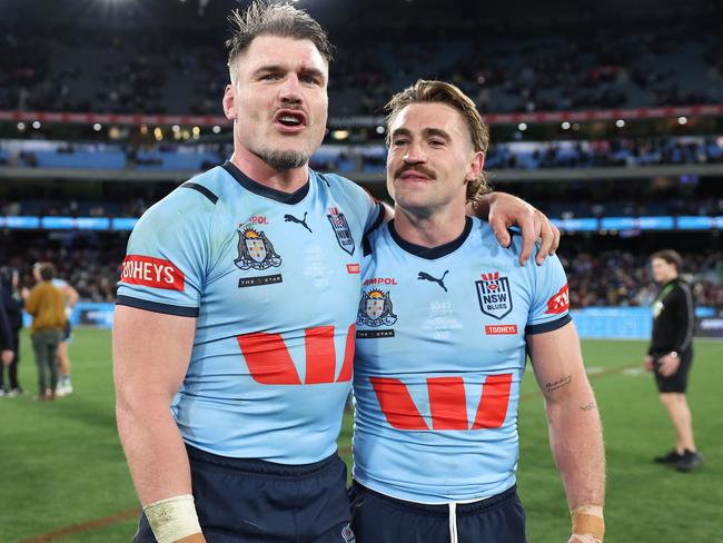 MELBOURNE, AUSTRALIA - JUNE 26: Angus Crichton and Connor Watson of the Blues celebrate after winning game two of the men's State of Origin series between New South Wales Blues and Queensland Maroons at the Melbourne Cricket Ground on June 26, 2024 in Melbourne, Australia. (Photo by Cameron Spencer/Getty Images)