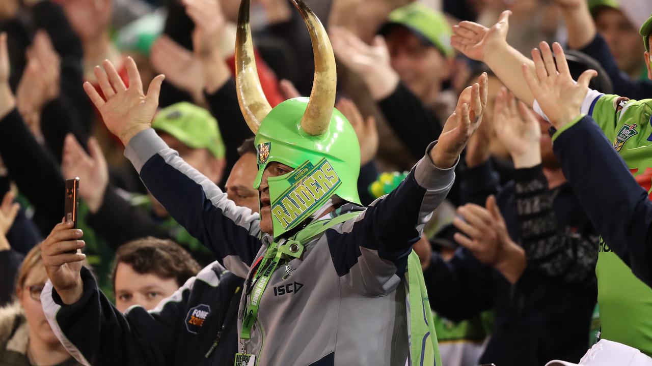 Canberra fans perform the Viking clap during a game.