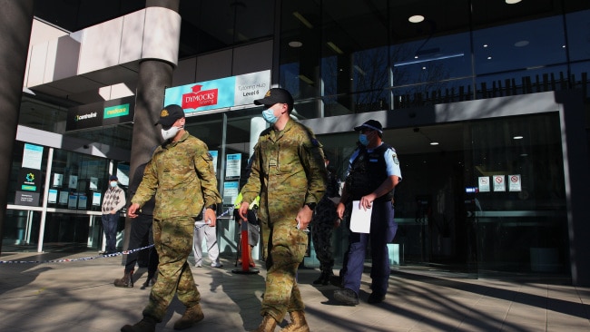 Australian Defence Force personnel and NSW police are seen being deployed from Bankstown Police Station on August 16. Picture: Getty Images