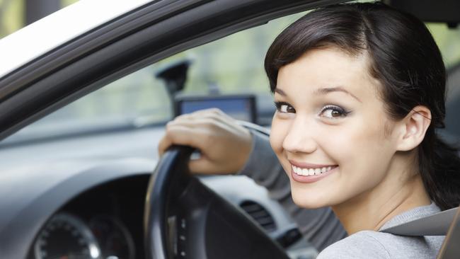 Pretty girl in a white car  istock image