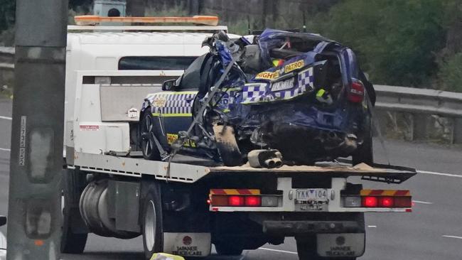 Emergency services remove the police car after the horror crash.