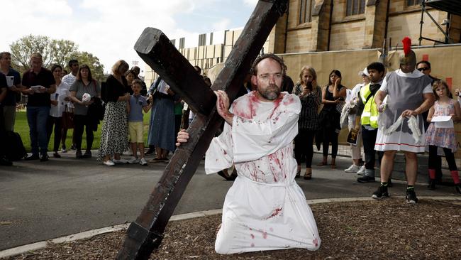 The group acted out the whipping and heckling of Jesus by Roman guards. Pictures: Chris Pavlich