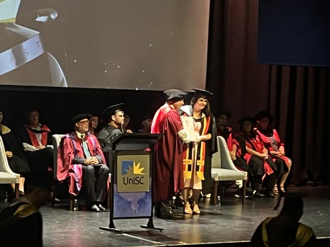 Graduates from the University of the Sunshine Coast's Fraser Coast campus celebrating at the Brolga Theatre.