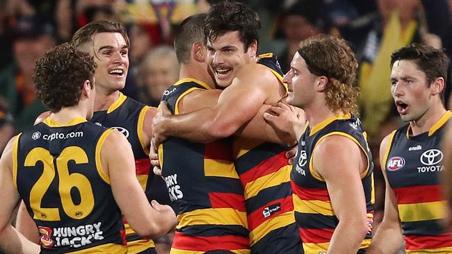 Darcy Fogarty and Taylor Walker celebrate a goal for the Crows. Picture: Getty Images