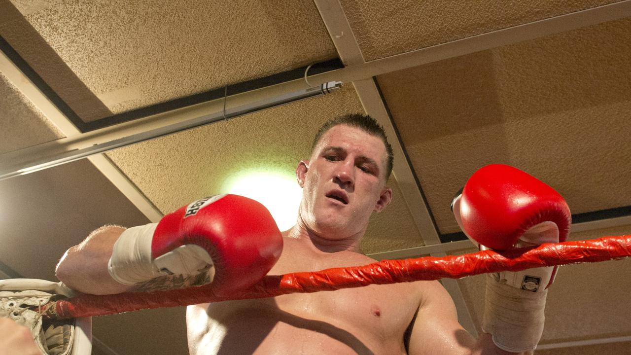 Paul Gallen and Herman Ene-Purcell fight it out in Toowoomba. Friday, Jan 29, 2016.