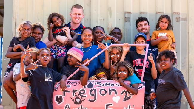 Adelaide’s Izak Rankine and Reilly O’Brien have been making the most of their off-season, travelling to the Anangu Pitjantjatjara Yankunytjatjara (APY) Lands this week to inspire hundreds of children and youth to get excited about maths and science. Picture: AFC