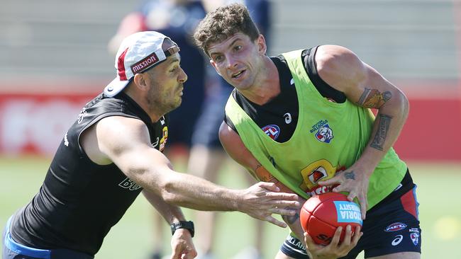 Midfielder Tom Liberatore, right, at Bulldogs training.