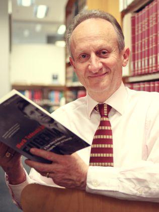 Author Mark Tedeschi with his book about Eugenia Falleni. Picture: Yie Sandison