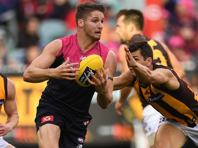 **FILE** A May 7, 2017 file photo of Jesse Hogan of the Demons (centre) is seen in action during the Round 7 AFL match between the Melbourne Demons and the Hawthorn Hawks at the MCG in Melbourne. The Melbourne Football club today disclosed that Hogan will undergo treatment for testicular cancer, Tuesday, May 17, 2017. (AAP Image/Julian Smith) NO ARCHIVING, EDITORIAL USE ONLY
