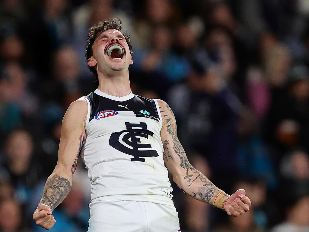 Zac Williams roars after kicking a goal against Port Adelaide. Picture: Sarah Reed/AFL Photos via Getty Images